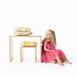The Small bench-desk shown with the child’s stool. Cushions sold separately.