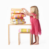 The small bench-desk is just the right size for your smaller children to use as a desk or for grown-ups to use as a seat.  Shown here with the child’s stool and various cushions in Small Stripes. Cushions sold separately.
