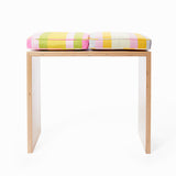 The small bench-desk shown with Small Stripes cushions in Pond (left) and Dusky Garden (right). Cushions sold separately.