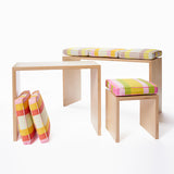 Child’s stool with Small Stripes cushion in Pond. Shown here with small bench-desk and large bench-desk.